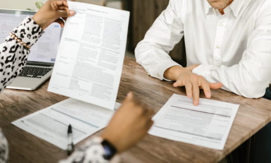 Hospital revenue recovery team reviewing out of network claim documentation Hospital revenue recovery team reviewing out of network claim documentation